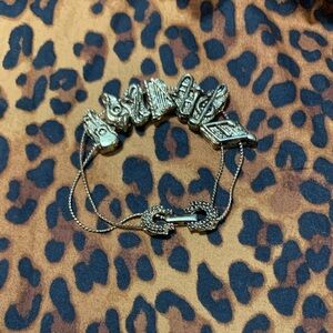 Gold-Tone Sliding Charm Bracelet with Mixed Decorative Charms